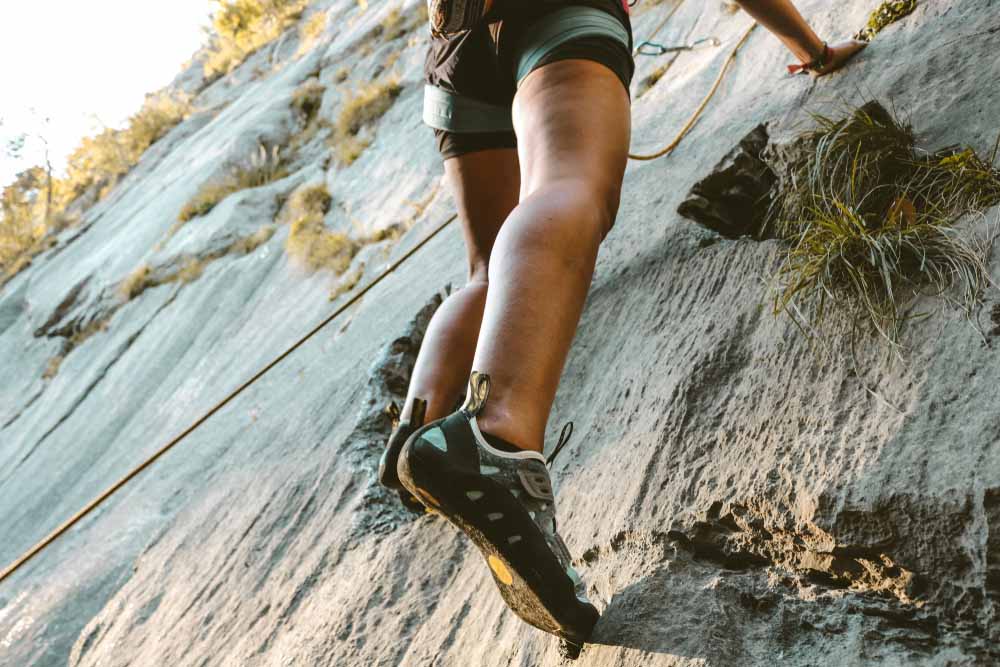 climbing shoes with socks on slab