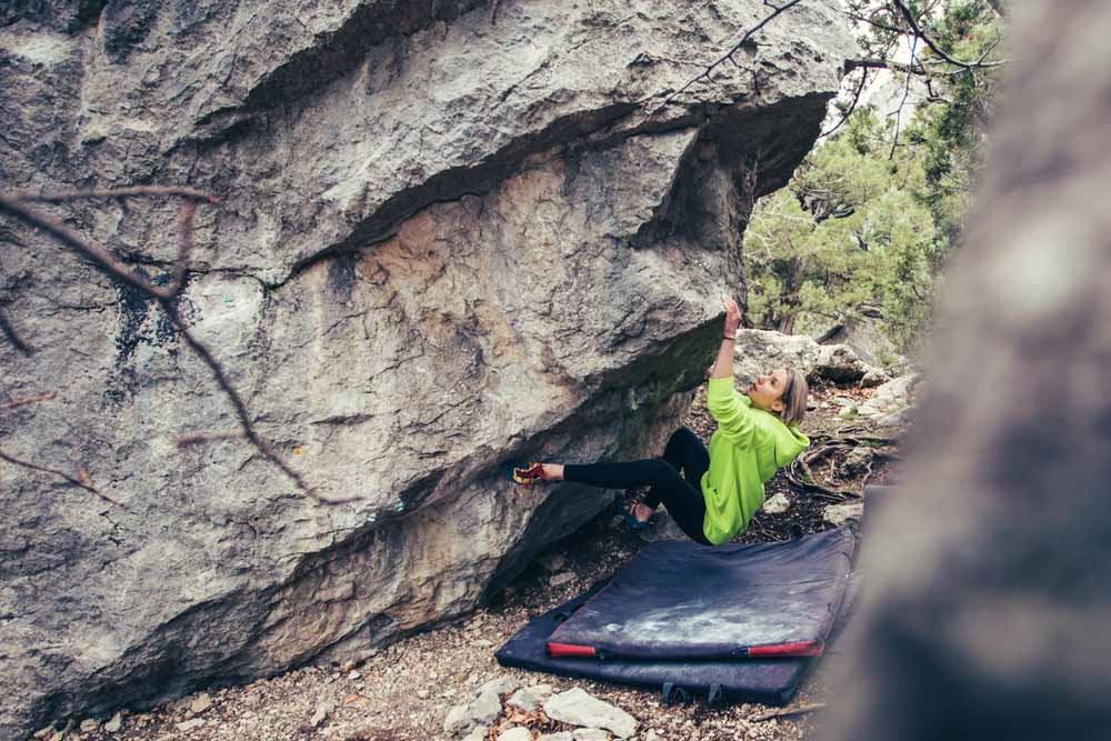 woman on low boulder