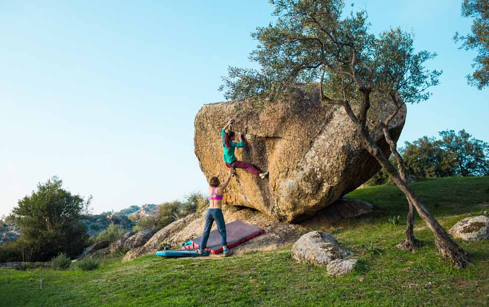 women bouldering outdoors