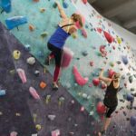 women in rock climbing tops