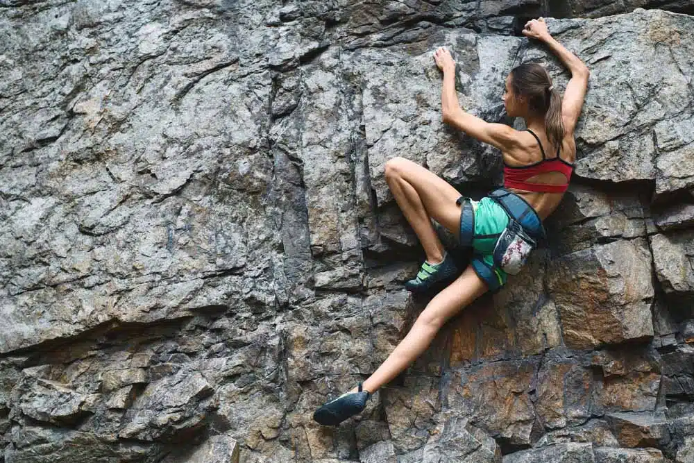 woman using flagging climbing technique