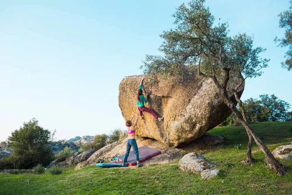 woman bouldering outdoors