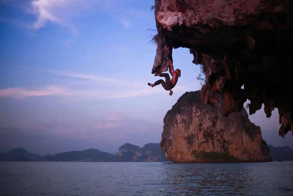 climber deep water soloing
