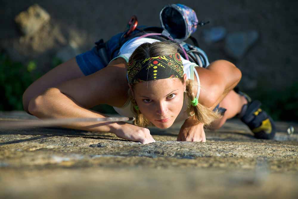 woman thinking while climbing