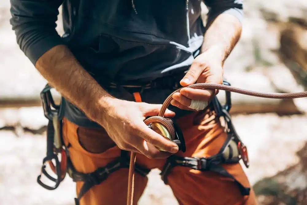 man lead belaying with a grigri