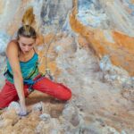 woman lead climbing