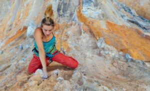 woman lead climbing