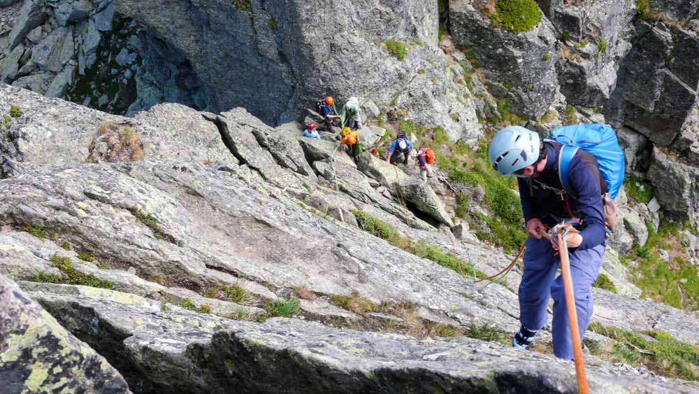 man rappelling wearing helmet