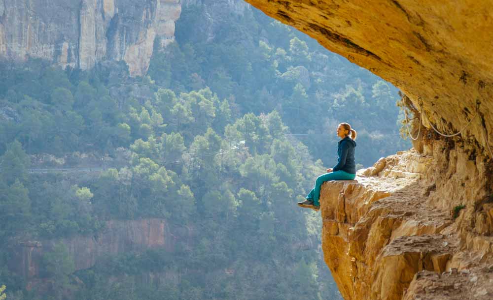 woman resting on ledge