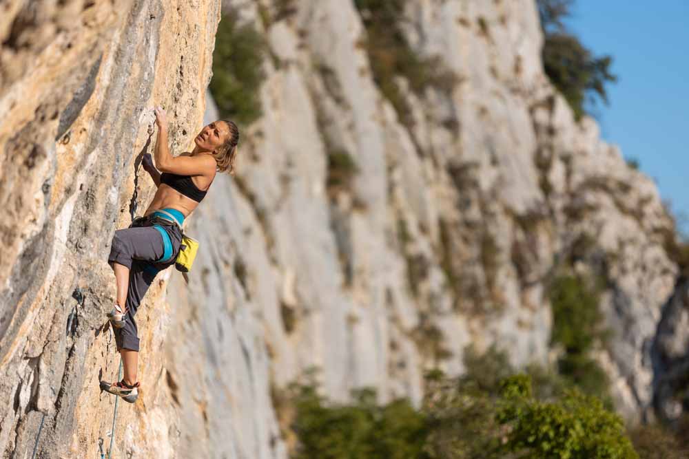 woman sport climbing in france 