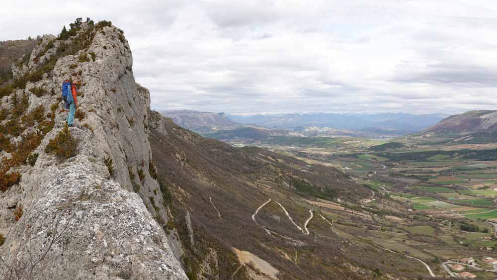 woman climber looks at countryside in france