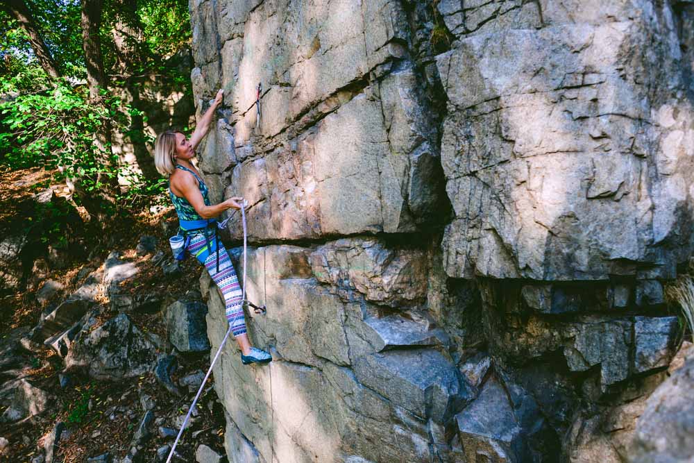 woman clips during sport climbing 