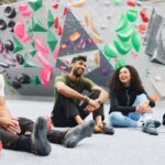 group of young people having fun bouldering