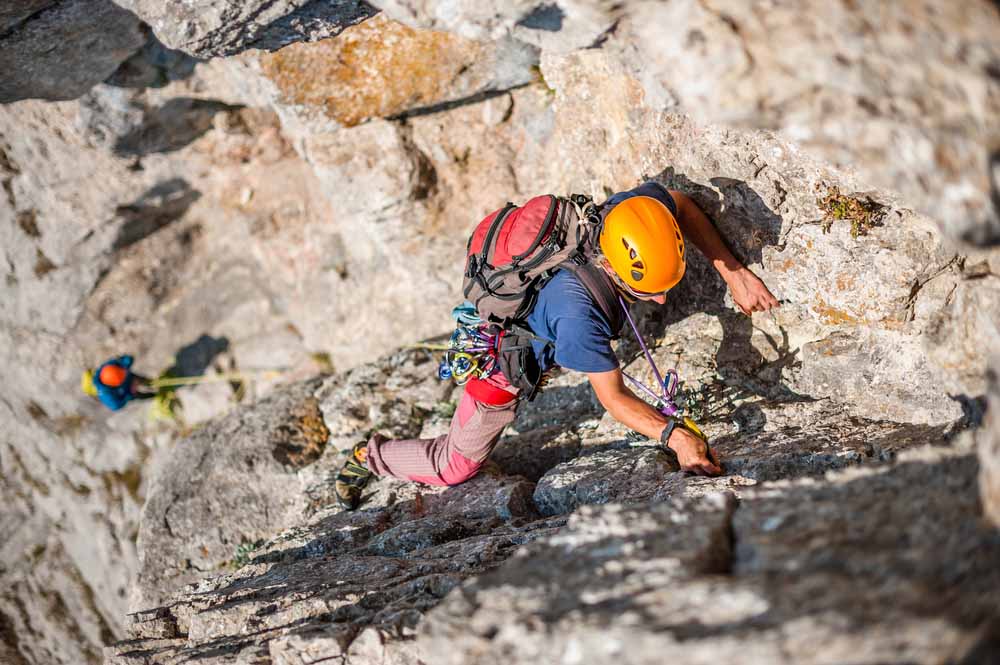 men doing multipitch climbing