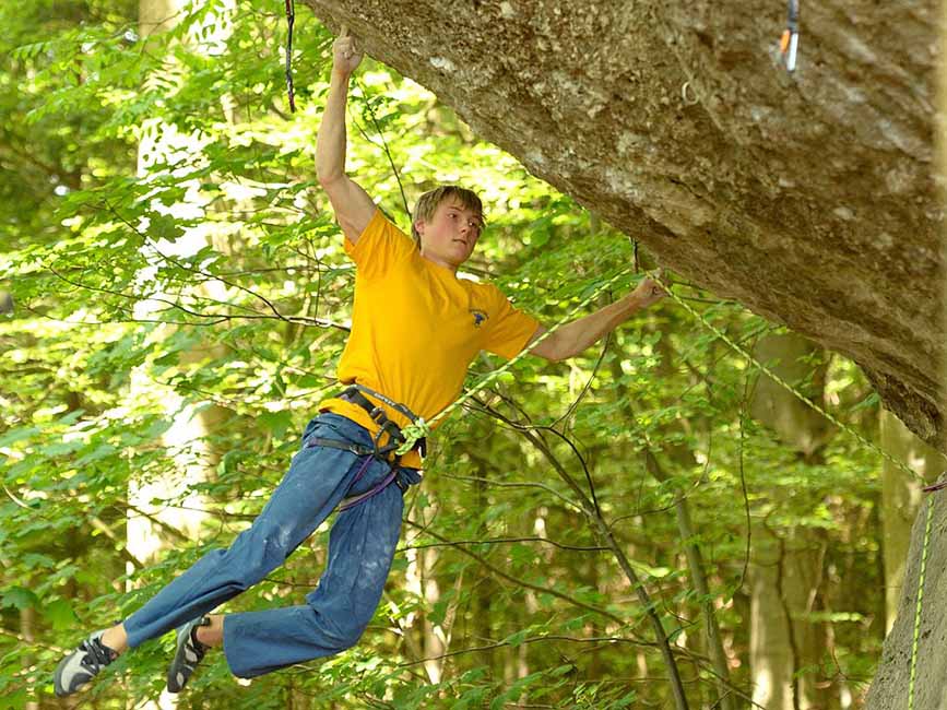 alex megos on action directe one of many famous rock climbs