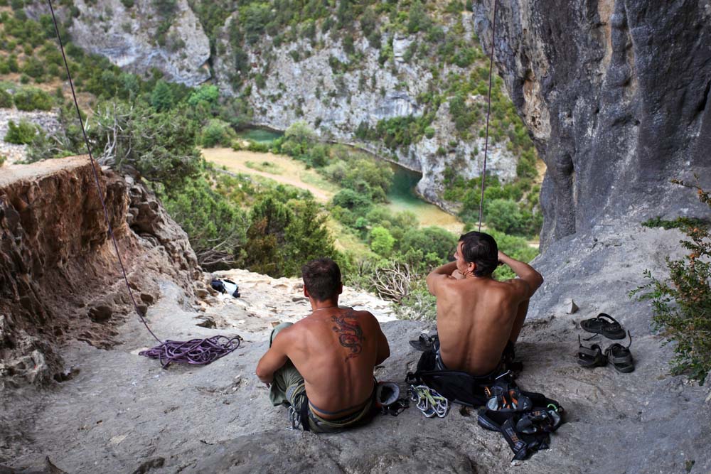 men resting after climbing in costa blanca