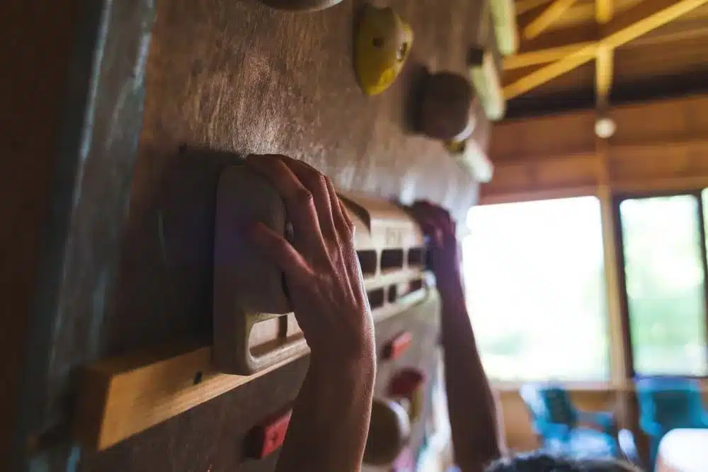 person hangboarding for finger strength training