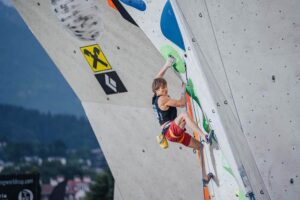 alex megos competing in sport climbing