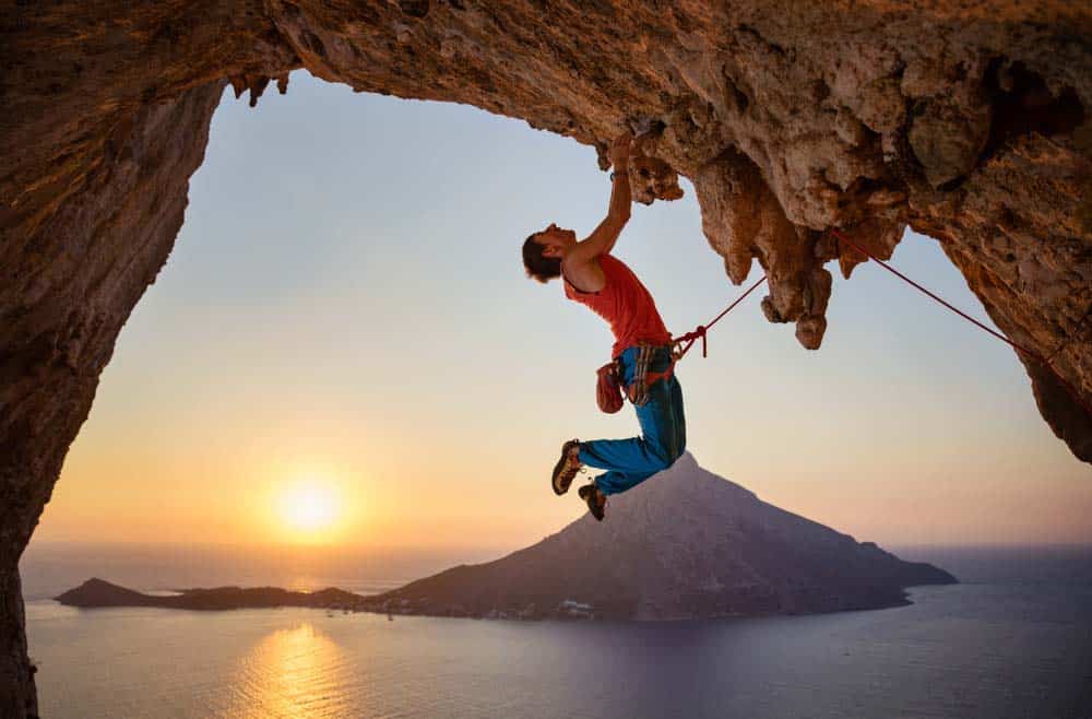 man climbing roof in kalymnos 