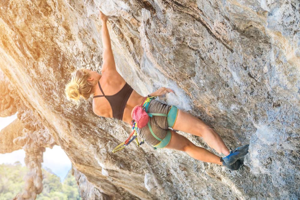 woman onsight climbing on tufas