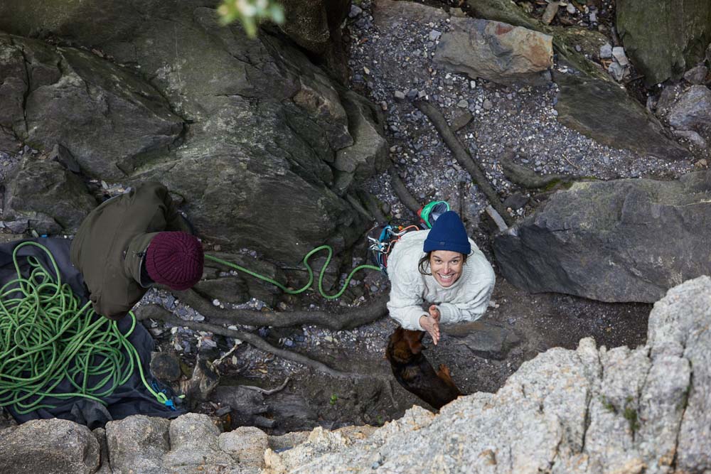 happy female climber preapres to climb 