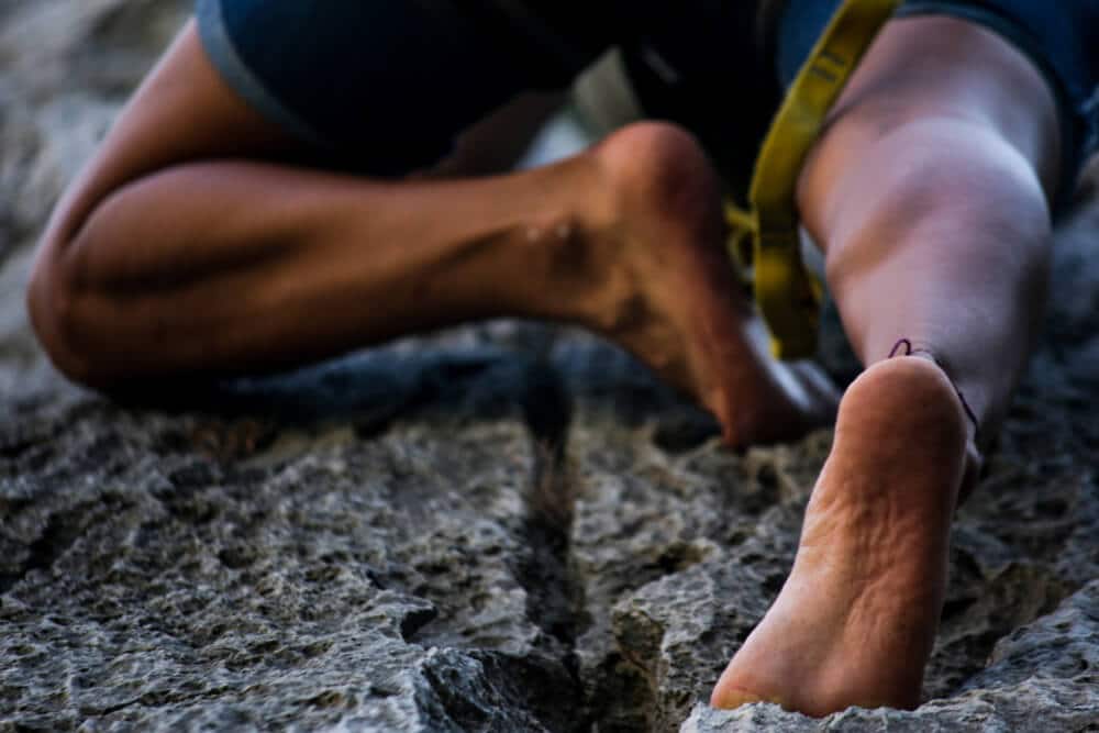 climber using bare feet