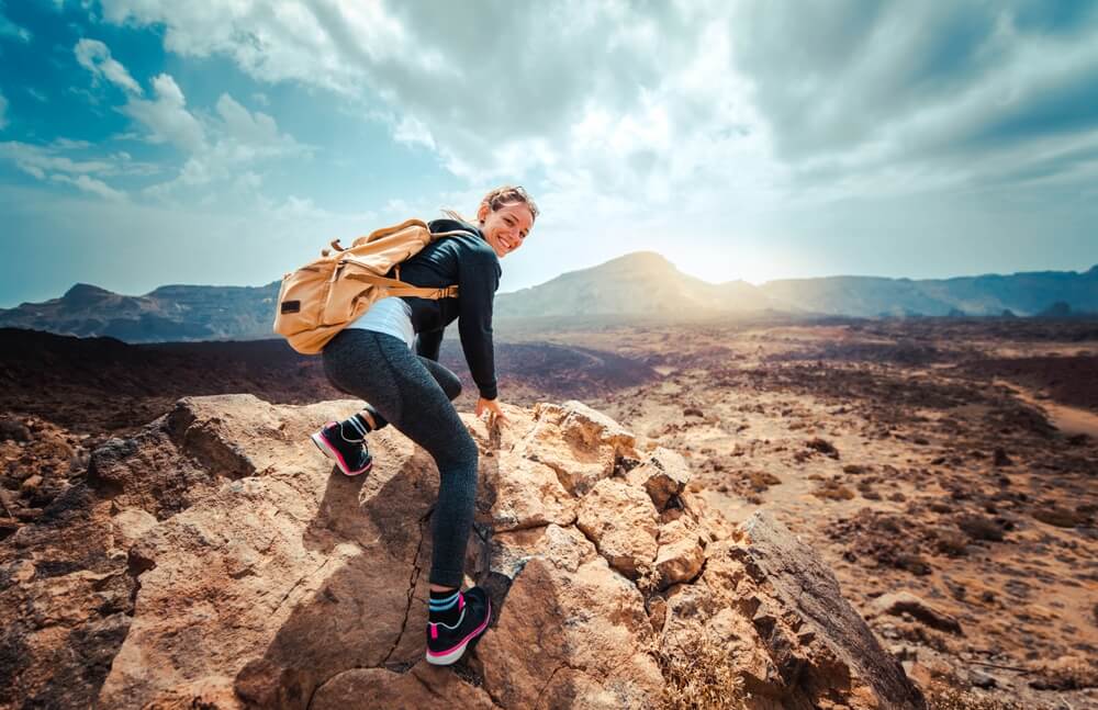 happy young woamn hiker in tenerife