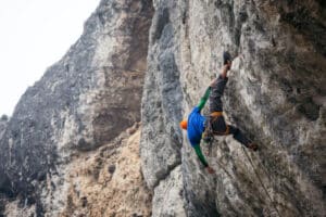 man climbing overhang using heel hook