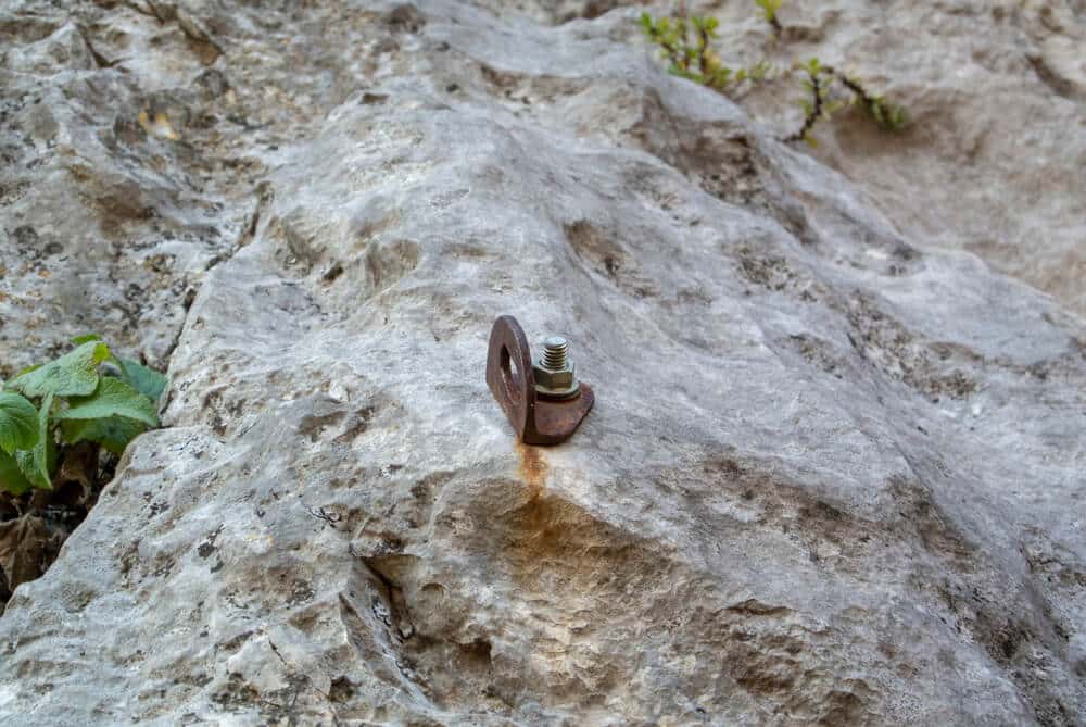 rusty bolt on rock