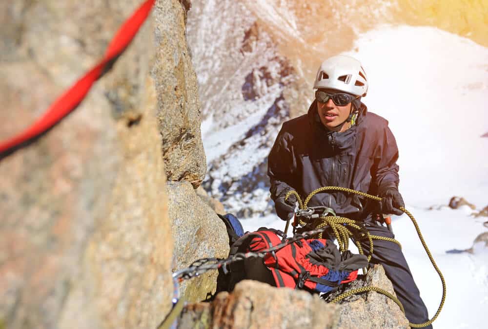 alpine climber prepares to descend