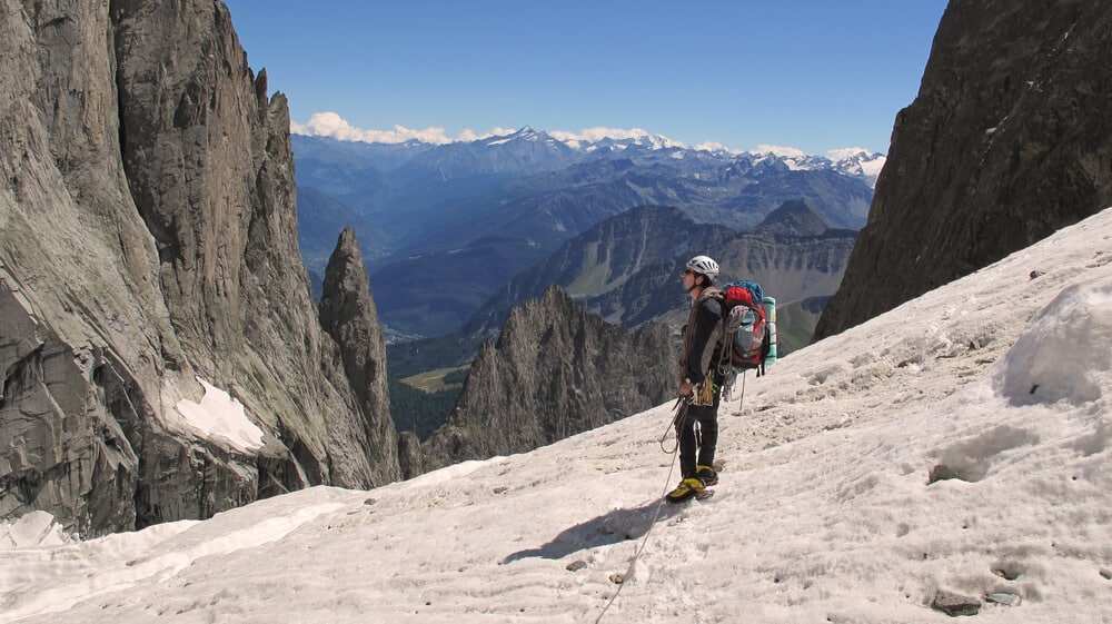 climber considering how to walk off climb in dolomites