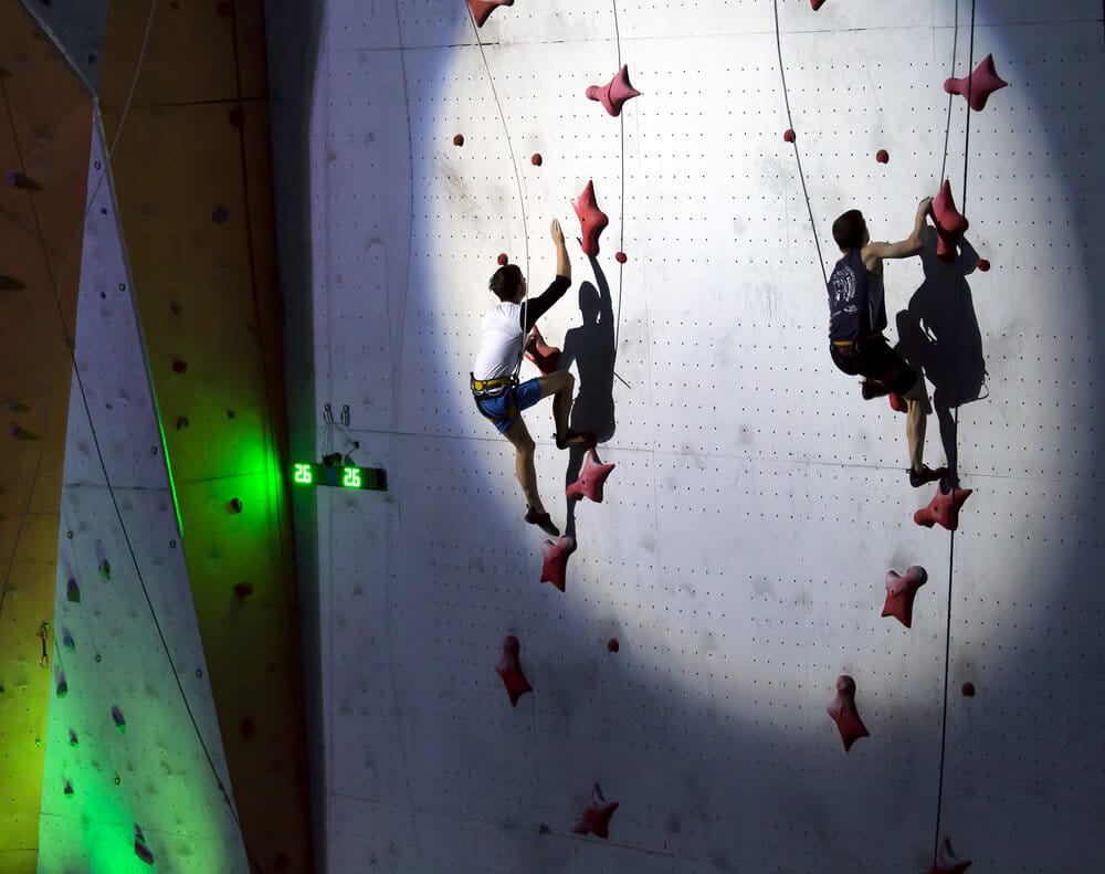 climbers speeding up wall