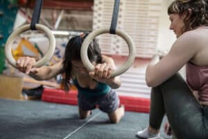 women performing strength training for rock climbing